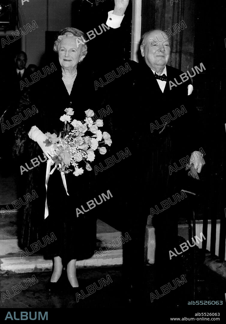 And The Crowds Cheered and Cheered : Back at No. 10 Downing Street after the Westminster Hall ceremony, Sir Winston Churchill full of emotion, acknowledges the crowds cheers. Smiling happily at his side is Lady Churchill. November 30, 1954.  (Photo by Evening Standard Picture).