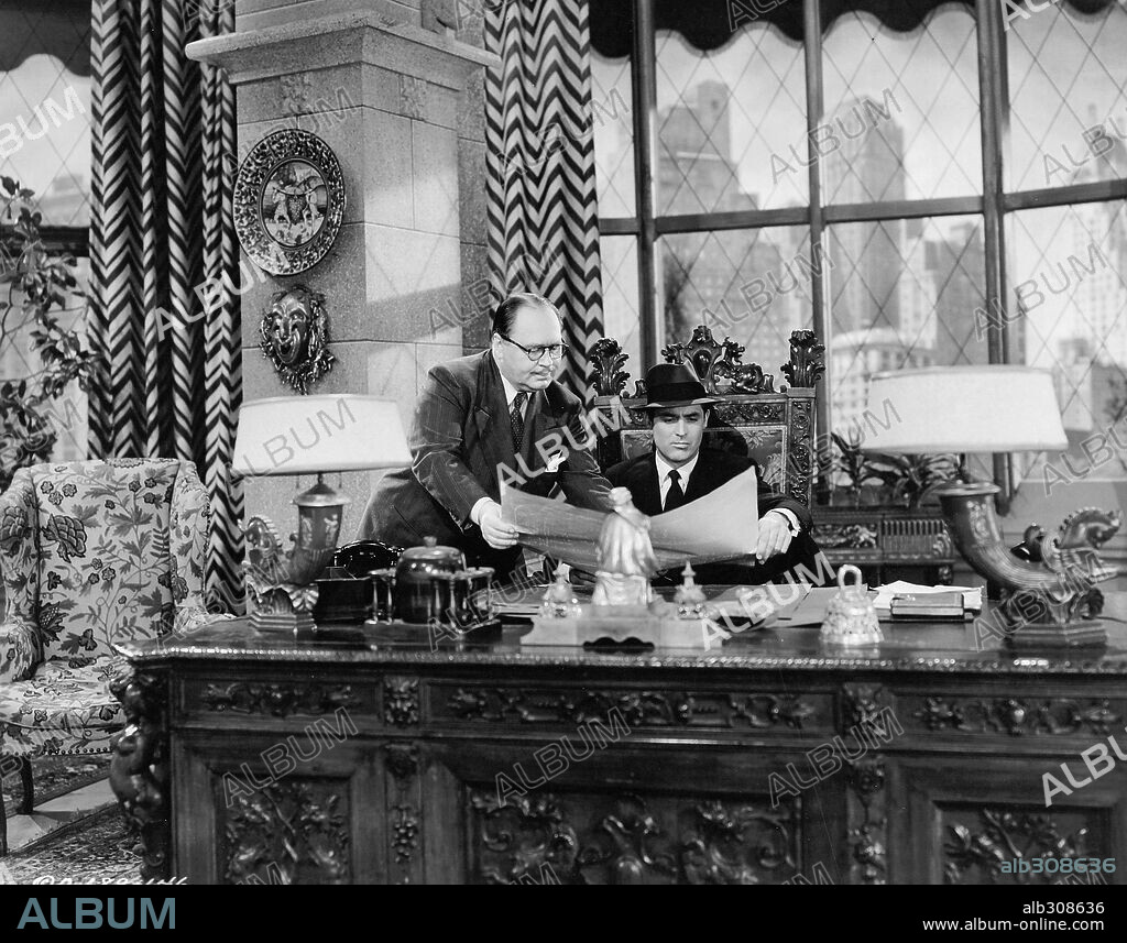 CARY GRANT and HOWARD FREEMAN in ONCE UPON A TIME, 1944, directed by ALEXANDER HALL. Copyright COLUMBIA PICTURES.