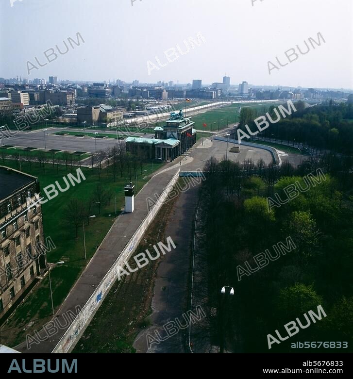 Berlin, Brandenburg Gate. View from the Reichstag building of the Brandenburg Gate and Berlin Wall. Photo, 1986.
