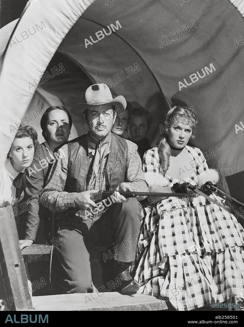 DENISE DARCEL and ROBERT TAYLOR in WESTWARD THE WOMEN, 1952, directed by WILLIAM A. WELLMAN. Copyright M.G.M.