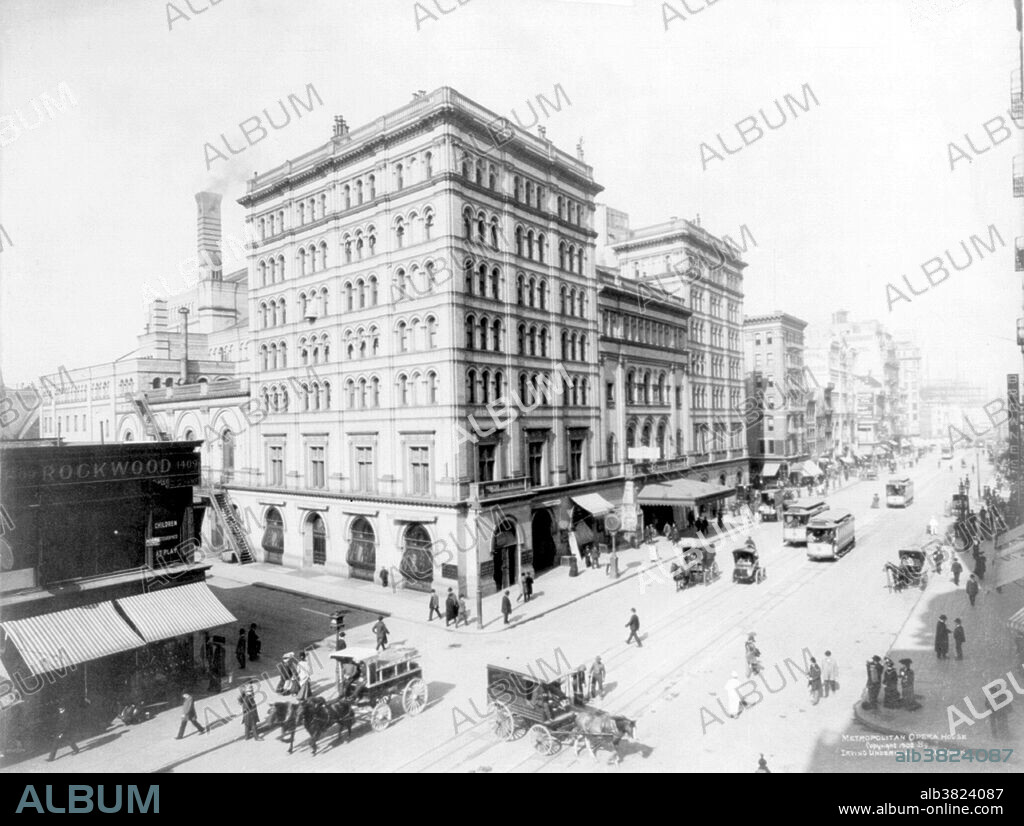 Sometimes referred to as "the old Met", the Metropolitan Opera House opened on October 22, 1883. It was located at 1411 Broadway, occupying the block between West 39th Street and West 40th Street. Nicknamed "The Yellow Brick Brewery" for its industrial looking exterior, the original Met was designed by J. Cleaveland Cady and had a seating capacity of 3,625. While the theater was noted for its excellent acoustics and elegant interior, as early as the 1900s the backstage facilities were deemed to be severely inadequate for a large opera company. The Met's scenery and sets were a regular sight leaning against the building outside on 39th Street where they had to be shifted between performances. The Met said goodbye to its old house on April 16, 1966, with a farewell performance featuring nearly all of the company's current leading artists. Despite a campaign to preserve the theater, it failed to obtain landmark status and was razed in 1967. Photographed by Irving Underhill, 1902.