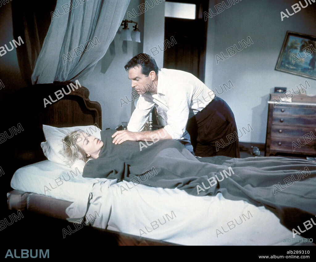FRED MACMURRAY and LANA TURNER in THE RAINS OF RANCHIPUR, 1955, directed by JEAN NEGULESCO. Copyright 20TH CENTURY FOX.