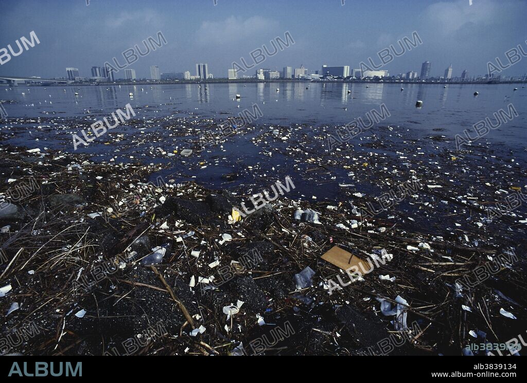 Litter floats on the surface of a river in Long Beach, California.