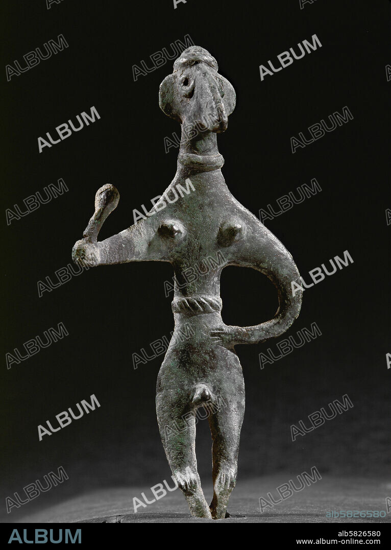 Canaanite figure Baal (?) holding a mace in the right hand, with penis and breasts. Bronze figurine (Late Bronze) Inv. R. E. H. 104.
