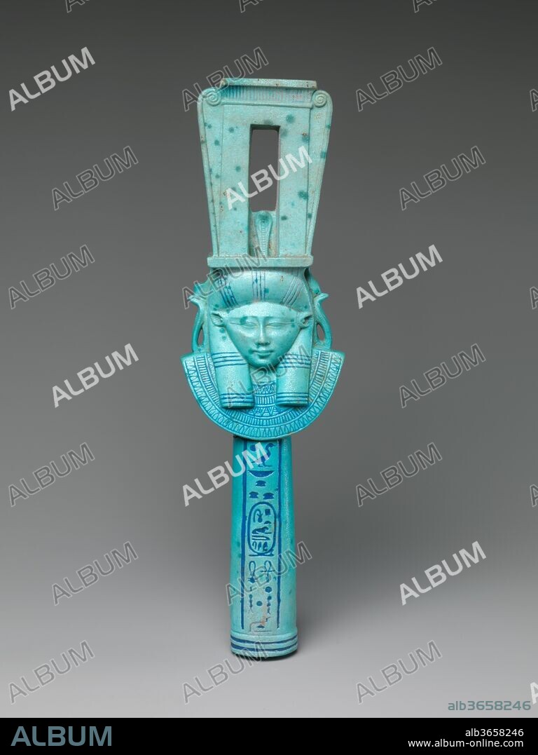 Faience Sistrum Inscribed with the Name of Ptolemy I. Dimensions: H. 26.7 cm (10 1/2 in.); W. 7.5 cm (2 15/16 in.); D. 3.7 cm (1 7/16 in.). Date: 305-282 B.C..
Sistra were musical instruments associated especially with the cult of great goddesses, including Hathor, Isis, Bastet, and others. Faience examples bearing a royal name appear to have been temple offerings.