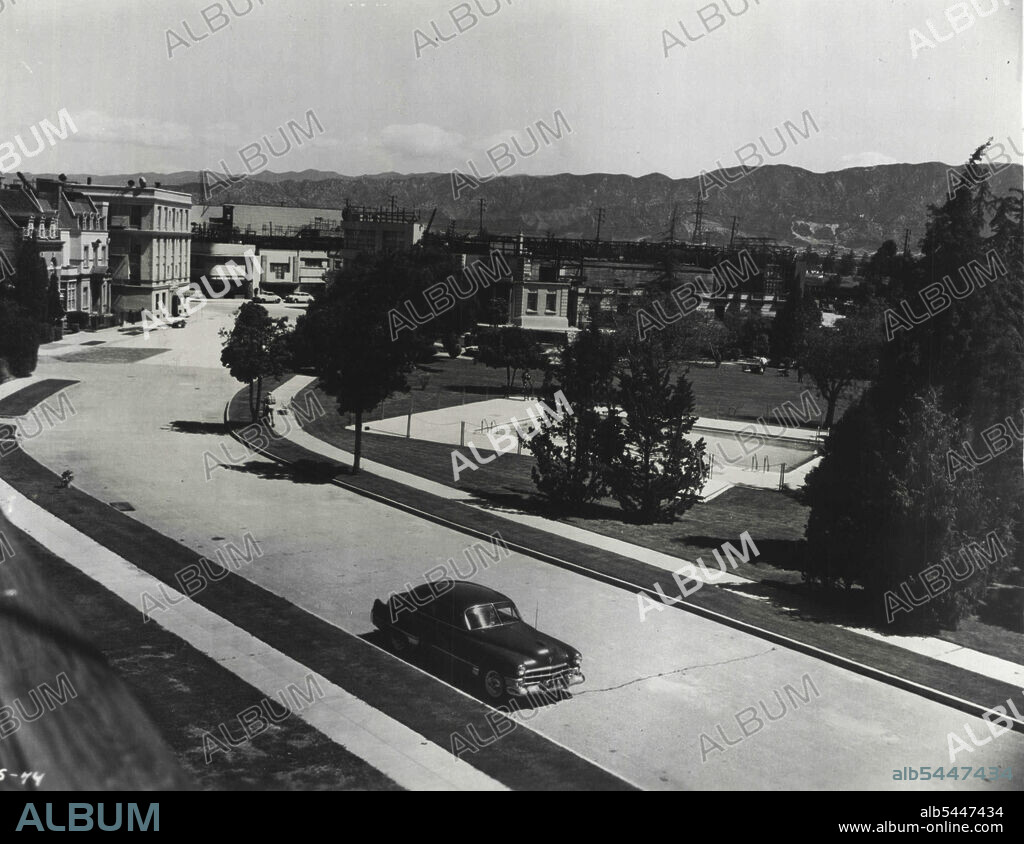 Columbia Ranch -- Many of the outdoor scenes in Columbia pictures are filmed at the studio ranch in the San Fernando Valley, near Burbank. Here are many permanent sets, including streets and buildings representative of different cities of this country and Europe. Lush, green park, which includes a swimming pool, typifies a wealthy neighborhood. October 27, 1952.