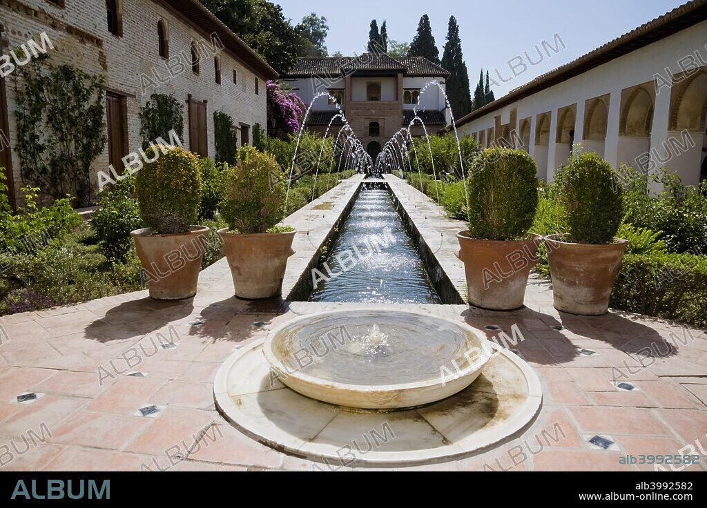 The Court of the Water Channe (l, the Patio the la Acequia), the Palacio de Generalife, Alhambra, Granada, Spain, 2007. The Palacio de Generalife was the summer palace and country estate of the Nasrid sultans of Granada. The palace and gardens were built during the reign of Muhammad III (1302-1309). Originally the palace was linked to the Alhambra by a covered walkway across the ravine that now divides them. The Generalife is one of the oldest surviving Moorish gardens. Alhambra was declared a World Heritage Site by UNESCO in 1984.