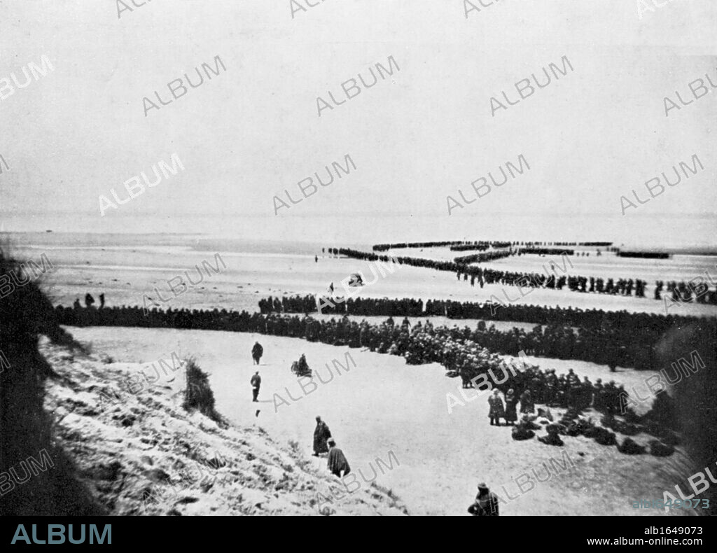 World War 2: British retreat from Dunkirk. British troops forming into winding queues waiting to board small boats which ferried them to larger vessels for transport back to UK. Constantly under German fire, between 26 May and 4 June, 300,000 members of the British Expeditionary Force and remnants of the French Army were evacuated.