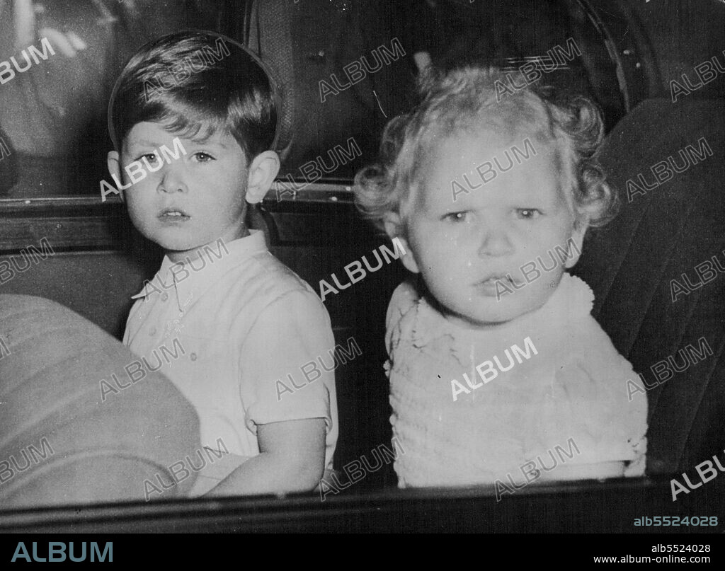 Prince Charles And His Sister After Birthday To Queen Mary -- Prince Charles (left) gazes calmly and Princess Anne with intense curiosity at the Crowes gathered outside Marlborough House, London, to-day (Monday) as the Royal children drive away after calling on their great-grandmother Queen Mary, to with her many happy returns on her 86th birthday. May 26, 1952. (Photo by Reuterphoto).