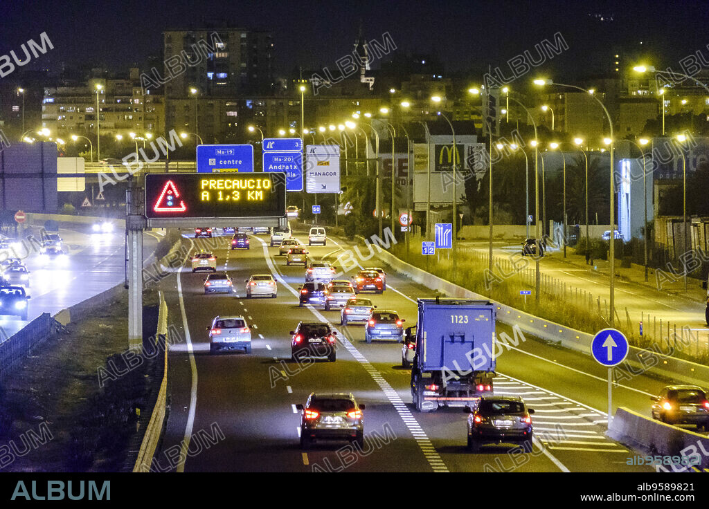 Nighttime vehicle lights on La-19, Levante Highway, Palma, Mallorca, Balearic Islands, Spain, Europe.