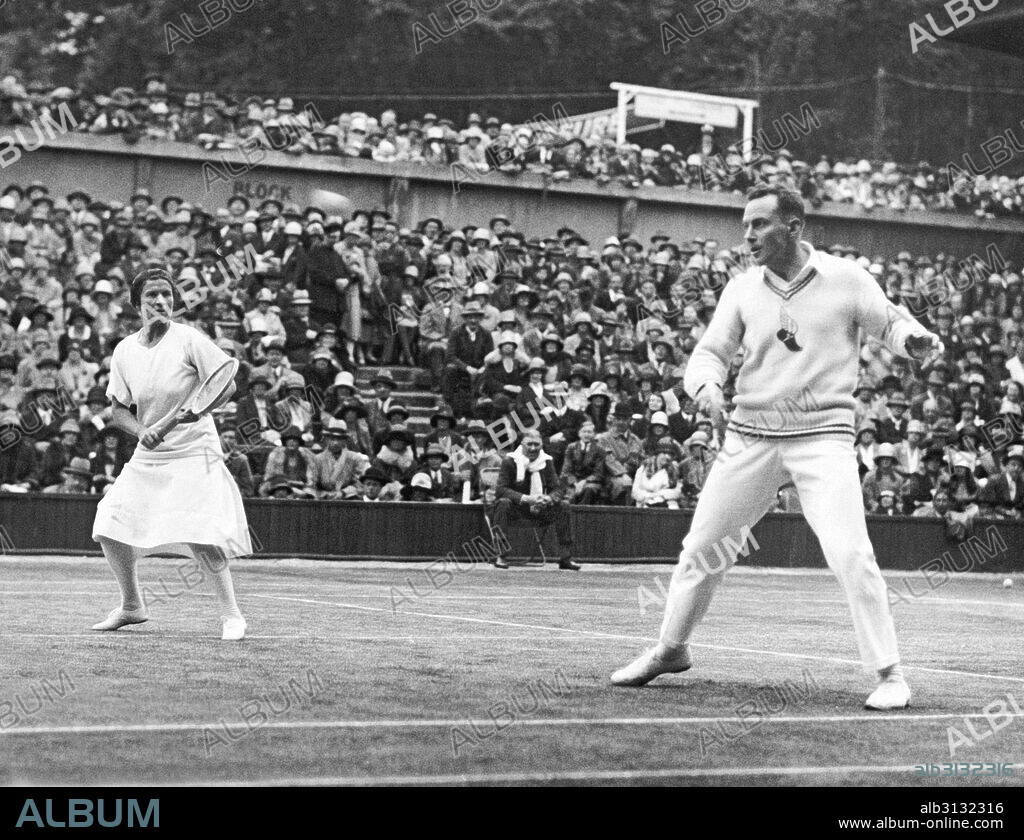 London, England:  1927 Americans Elizabeth Ryan and Frank Hunter playing against the British team in the Lawn Tennis Championships at Wimbledon. They won the mixed doubles championship.