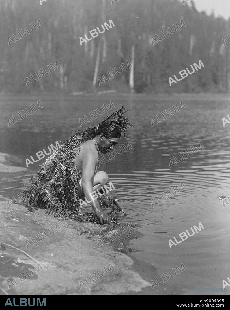 Nootka indian taking ceremonial bath, before whale hunt, c1910. Photograph by Edward Curtis (1868-1952).