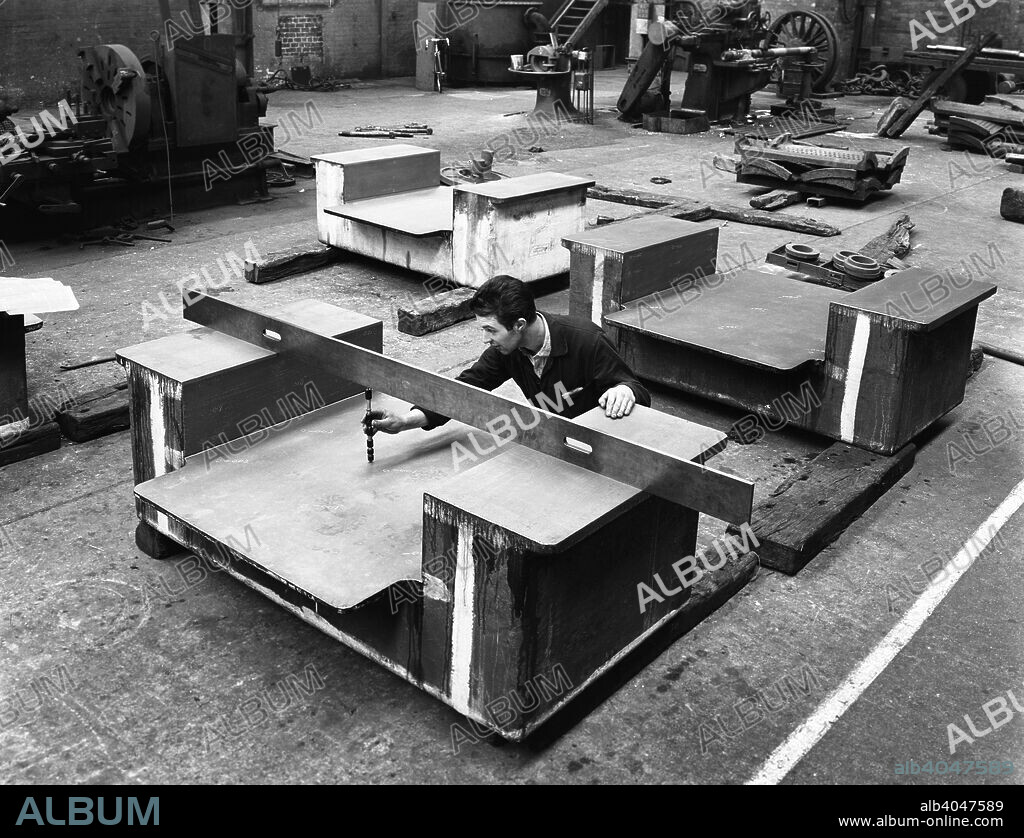 An engineer at work at the Edgar Allen Steel Foundry, Sheffield, South Yorkshire, 1962. An engineer using a precision depth guage to quality check a giant magnet casting. The quality of Sheffield presision castings was known throughout the world and Edgar Allen's were still producing quality castings in the late 2000s.