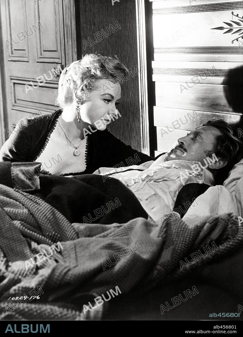 JO VAN FLEET and KIRK DOUGLAS in GUNFIGHT AT THE O. K. CORRAL, 1957, directed by JOHN STURGES. Copyright PARAMOUNT PICTURES.
