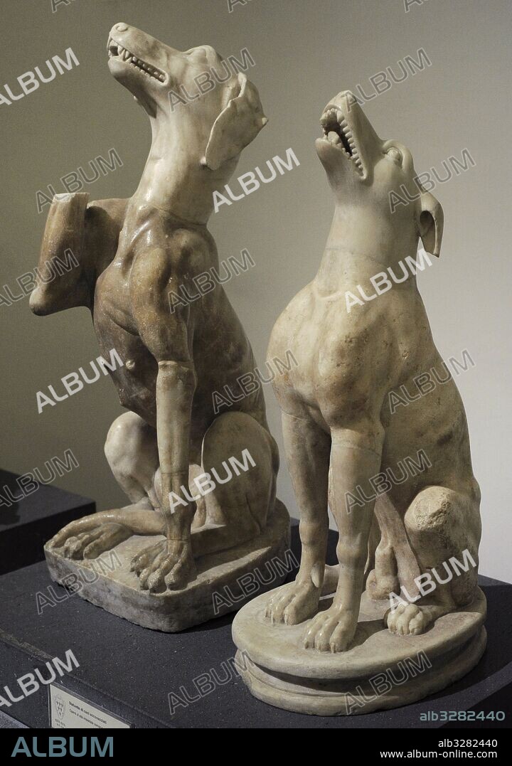 Roman art. Statues. Dogs crouching. Roman Imperial Age. National Archaeological Museum, Naples. Italy.