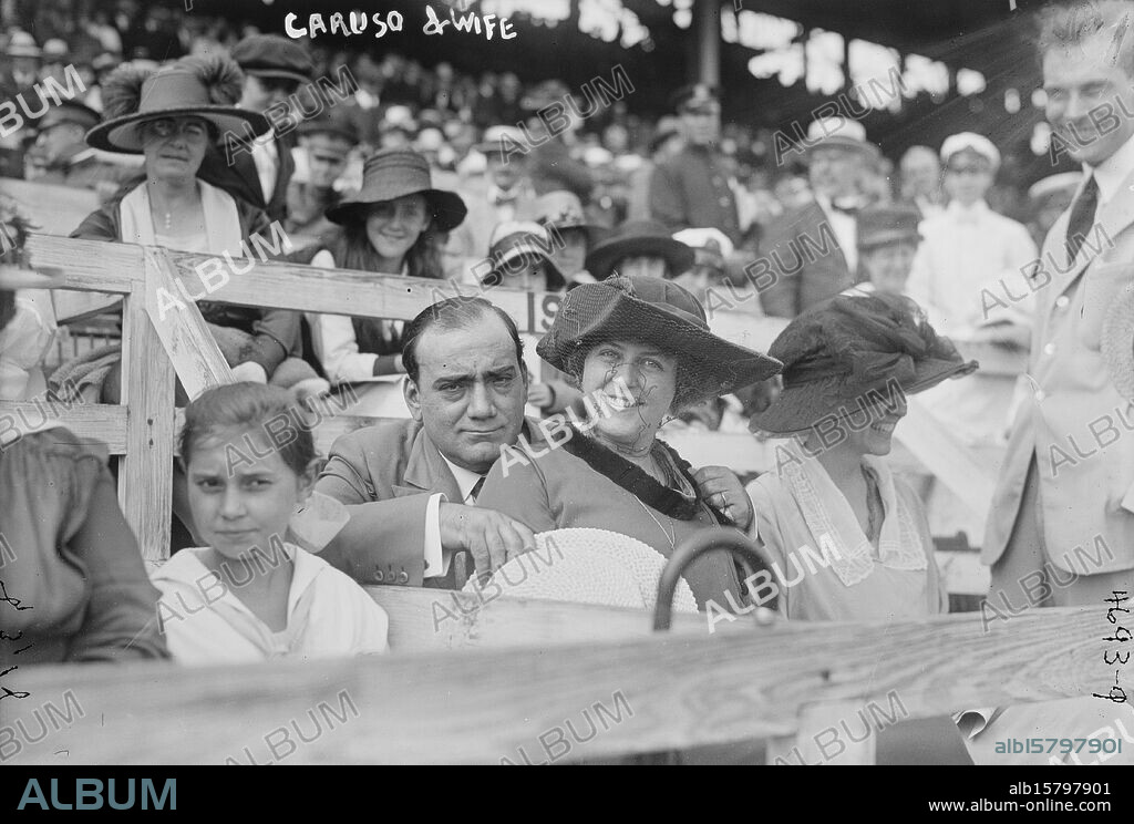 Caruso & wife, Photograph shows Italian tenor opera singer Enrico Caruso (1873-1921) and his wife, the former Miss Dorothy Park Benjamin (1893-1955), at a Police Field Day benefit at Sheepshead Bay Speedway, Brooklyn, New York City, August 31, 1918., 1918 August 31, Glass negatives, 1 negative: glass.