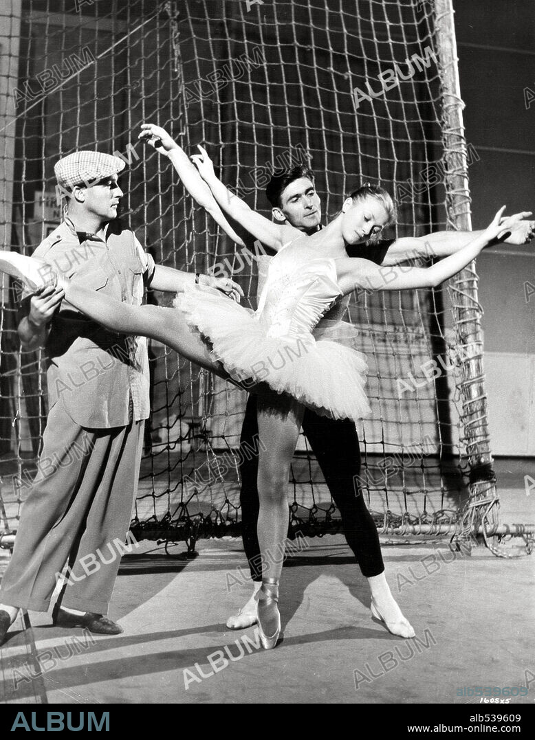GENE KELLY in INVITATION TO THE DANCE, 1956, directed by GENE KELLY. Copyright M.G.M.