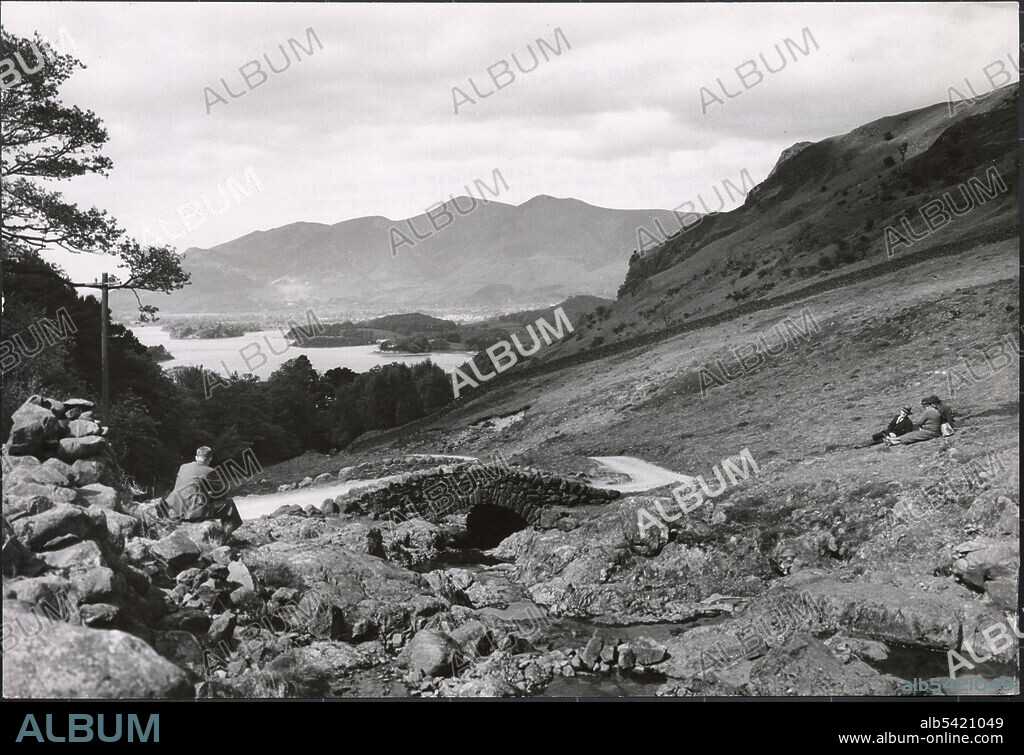 J DIXON SCOTT. Ashness Bridge, Borrowdale, Allerdale, Cumbria, 1930s. The view towards Derwent Water and Skiddaw from Ashness Bridge.