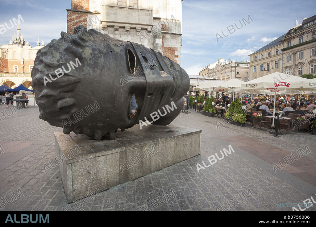 Eros Bendato, bronze sculpture by Igor Mitoraj in Rynek Glowny, the main market square of the Old Town, UNESCO World Heritage Site, Krakow, Poland, Europe.
