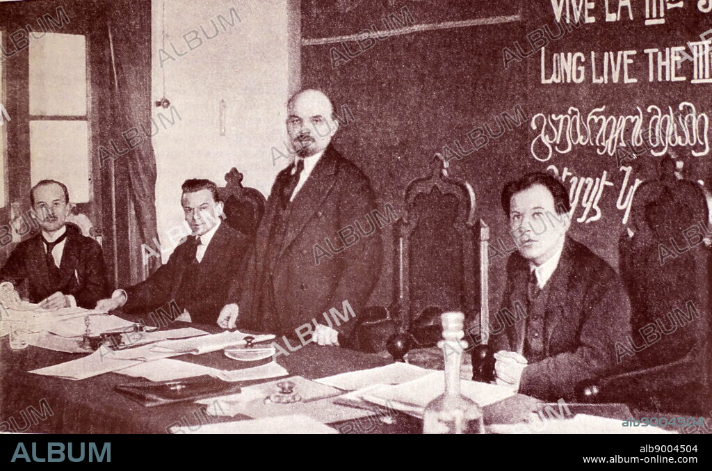 V.I. Lenin in the Presidium of the 1st Congress of the Communist International. Sitting from left to right: G. Klinger (RSFSR), G. Eberlein (Germany), F. Platten (Switzerland). Moscow. Kremlin. March 1919.