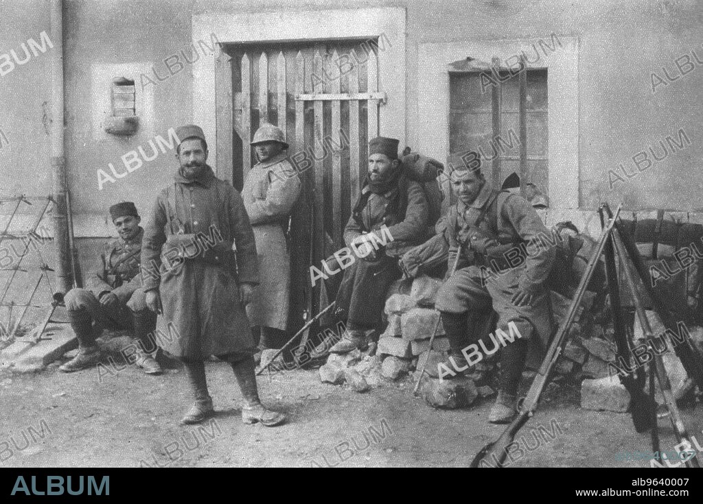 ''Deux Groupes de Combattants de Douaumont; Tirailleurs d'une division marocaine revenant du feu. From "L'Album de la Guerre 1914-1919, Volume I" [L'Illustration, Paris, 1924].