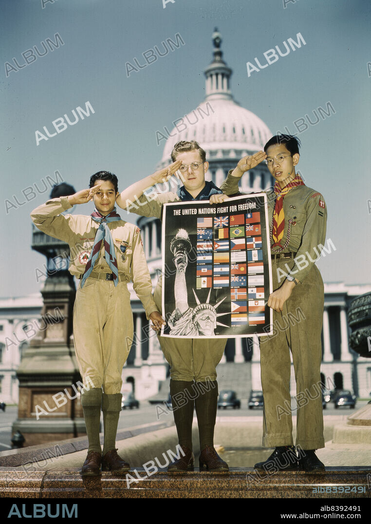 JOHN ROUS. United Nations Fight for Freedom : colored, white and Chinese Boy Scouts in front of Capitol, They help out by delivering poster to help the war effort.