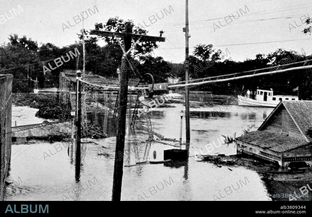 The Great Mississippi Flood of 1927 was the most destructive river flood in the history of the United States. The flood began when heavy rains pounded the central basin of the Mississippi in the summer of 1926. By September, the Mississippi's tributaries in Kansas and Iowa were swollen to capacity. Flooding overtook the levees causing the Mounds Landing to break with more than double the water volume of Niagara Falls. The Mississippi River broke out of its levee system in 145 places and flooded 27,000 square miles. This water flooded an area 50 miles wide and more than 99 miles long. The flood caused over $400 million in damages and killed 246 people in seven states. The flood affected Arkansas, Illinois, Kentucky, Louisiana, Mississippi, Missouri, Tennessee, Texas, Oklahoma and Kansas. By May 1927, the Mississippi River below Memphis, Tennessee, reached a width of 60 miles. Photo originally captioned: "The Great Mississippi River Flood of 1927. Teche Bayou, New Iberia, Louisiana. This was the first recorded experience of this kind at Teche Bayou." From: "The Floods of 1927 in the Mississippi Basin", Frankenfeld, H.C., 1927. Monthly Weather Review Supplement No. 29.