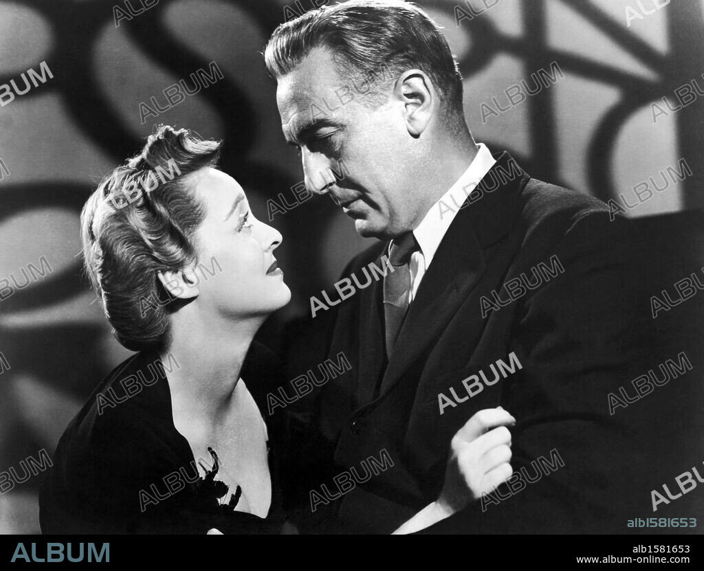 BETTE DAVIS and PAUL LUKAS in WATCH ON THE RHINE, 1943, directed by HERMAN SHUMLIN. Copyright WARNER BROTHERS.