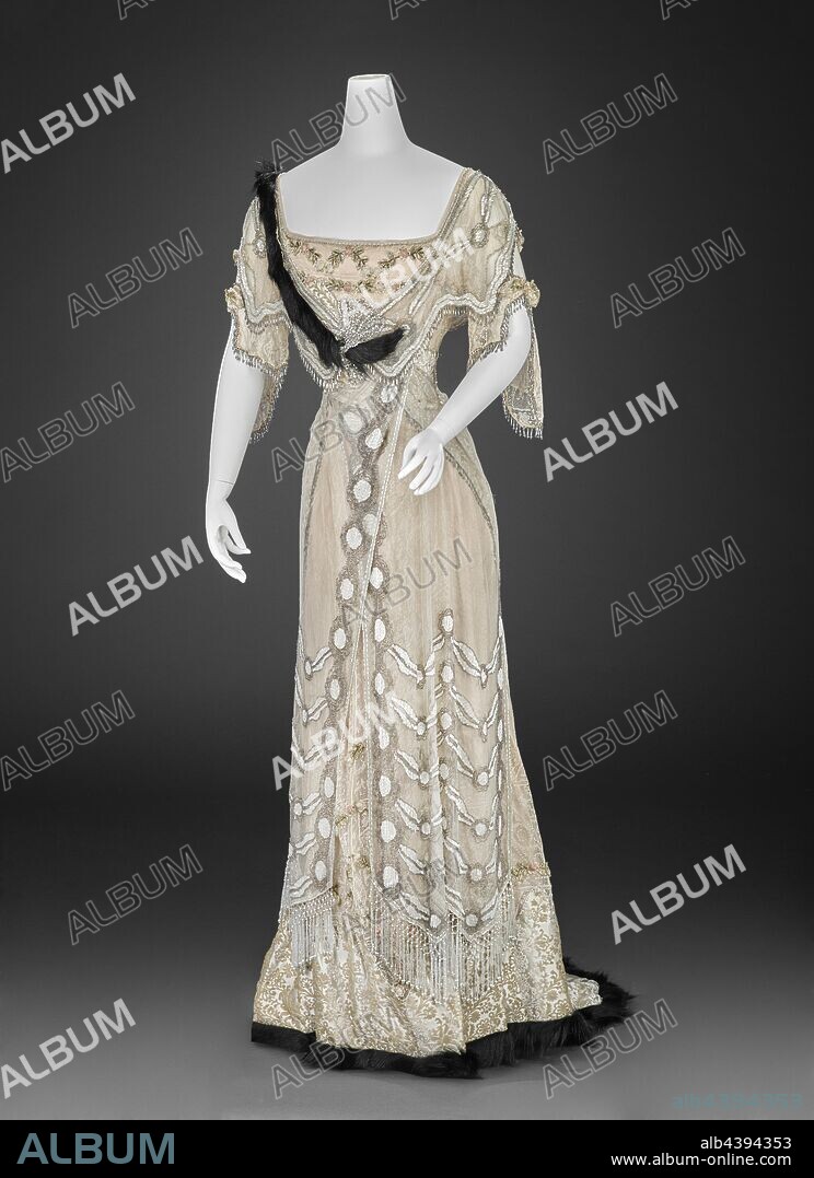evening dress, Girolamo Giuseffi, Designer (American, 1864-1934), G. Giuseffi Ladies' Tailoring Company, Design House (American), 1908-1915, silk voided velvet, silk netting, lace, silk chiffon, glass beads, rhinestones, mother-of-pearl bugle beads, fur, center back 63 in., center front 52-1/2 in., bust 29 in., waist 21-1/2 in., sleeve length 17 in., shoulders 14 in., Label, sewn: G. Giuseffi L.T. Co., St. Louis, Textile and Fashion Arts.