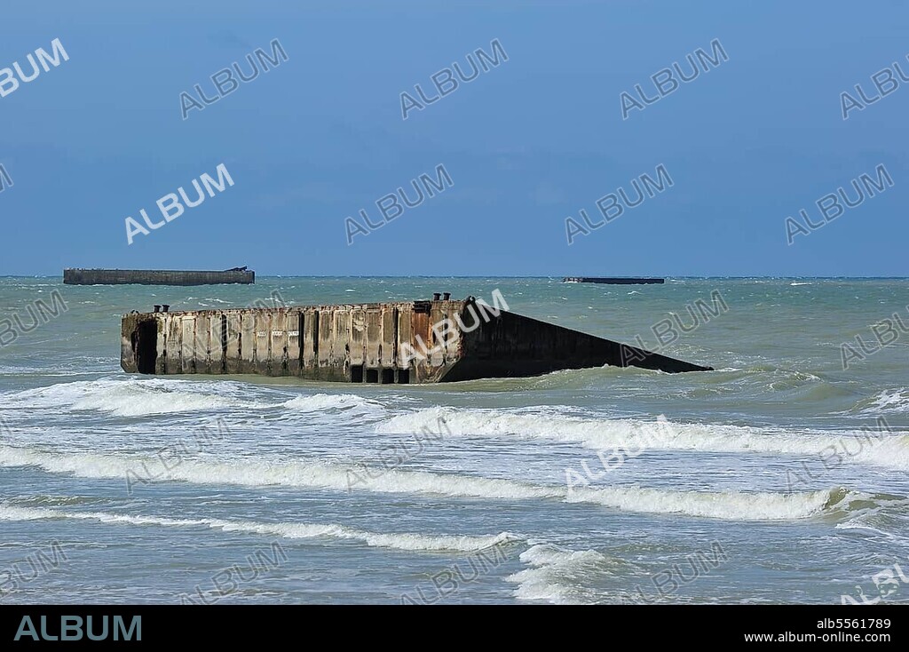 Concrete boxes, known as Phoenix Caissons, in the sea were used as breakwaters and to form an improvised harbour, Mulberry harbour, off Gold Beach during World War II near Arromanches, Normandy, France