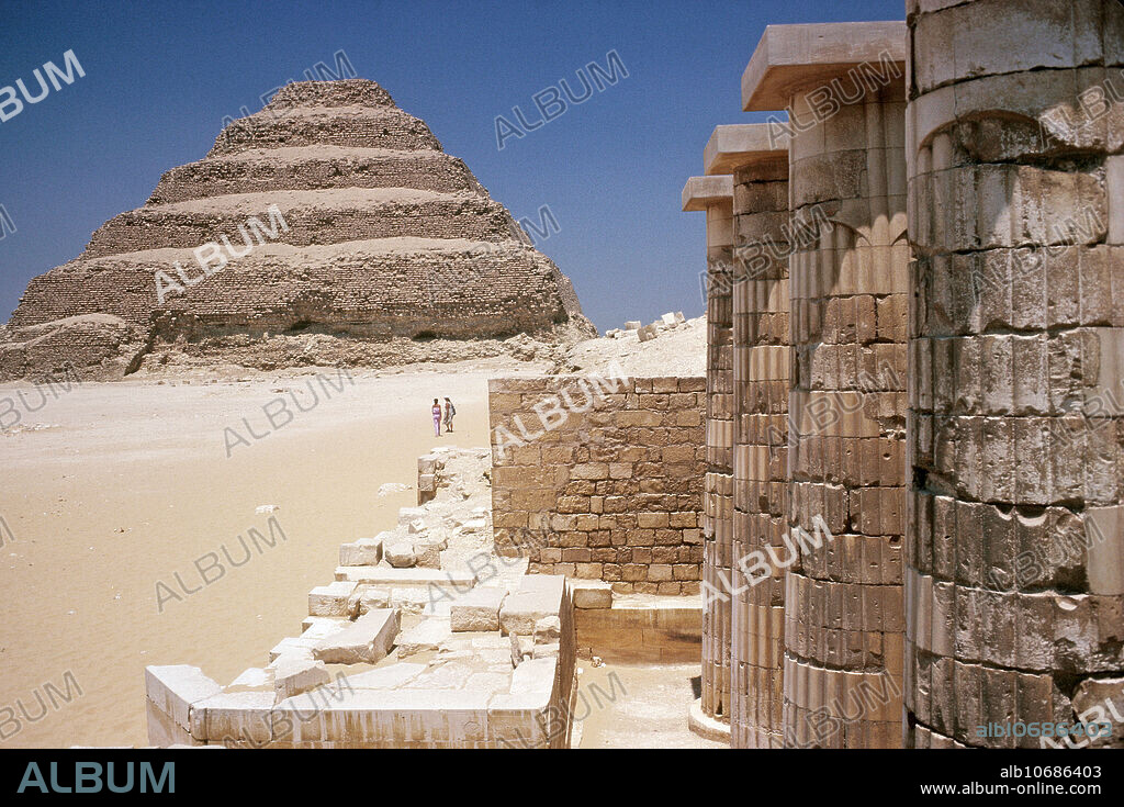 View of the Pyramid of Djoser at the Saqqara necropolis northwest of the city of Memphis in Egypt, is the oldest known structure constructed completely of natural stone. It was built during the third dynasty, around 2625 BC for the burial of Pharaoh Djoser by his Vizier Imhotep. The pyramid originally stood 62 meters tall and was clad in polished white limestone. The step pyramid (or proto-pyramid) is considered to be the earliest large-scale stone construction.