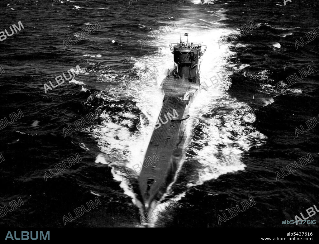 The Biggest U-Boat Surrender -- Three of the surrendering U-Boats. Fifteen U-boats, in two columns and escorted by H.M. ships and aircraft of the Royal Navy, approached Loch Eriboll on set; 19th May, 1945. The U-boats were contacted off the Norwegian coast and ordered to congregate in a fjord. Then under the instructions of the senior R.N.Officer, the biggest surrender convoy proceeded in good order to the North West coast of Scotland during the week-end. The U-boats are remaining at Loch Eribol.
