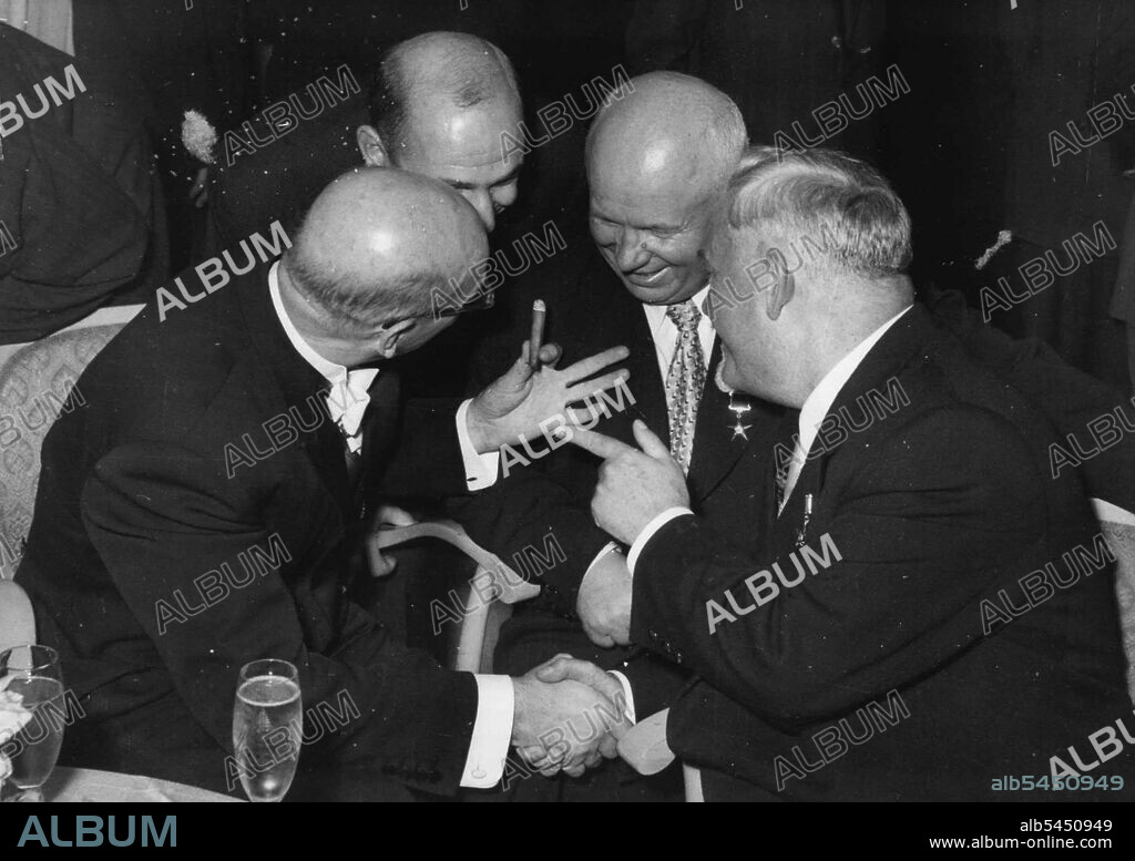 Smiles All Round -- In General Mood are Soviet Primer Marshal Nikolai Bulganin(right), Soviet Communist Party first secretary Nikita Khrushchev (second from right) and Finnish Premier U.K. Kekkonen (left) as they chat during a reception for the Soviet Government at the Finnish Embassy here. The man second from left is unidentified. September 23, 1955. (Photo by United Press Photo).