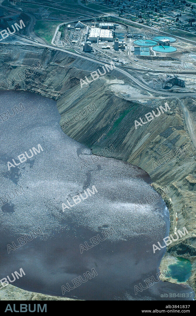 Berkeley Pit in the Silver Bow Creek/ Butte Area Superfund site, Montana. The highly toxic water in the pit is 875 feet deep, with a surface area of 140 acres. The wastewater is pumped to a treatment plant where the copper is precipitated out, and then the water is returned to the pit.