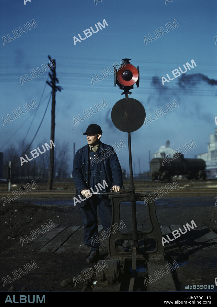 JACK DELANO. Daniel Senise throwing a switch while at work in an Indiana Harbor Belt Line railroad yard.