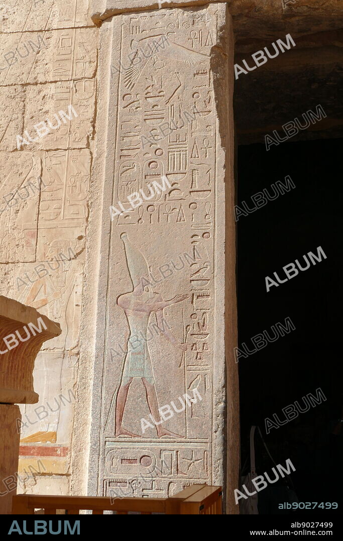 Wall relief (painted) depicting a pharaoh wearing the hedjet or White Crown for Upper Egypt. Temple of Hatshepsut, near Luxor, Egypt. The mortuary temple and tomb dates to the Eighteenth dynasty, and was designed by Senenmut, royal steward and architect of Hatshepsut. It was constructed during the 15th century BC, During the Eighteenth dynasty.