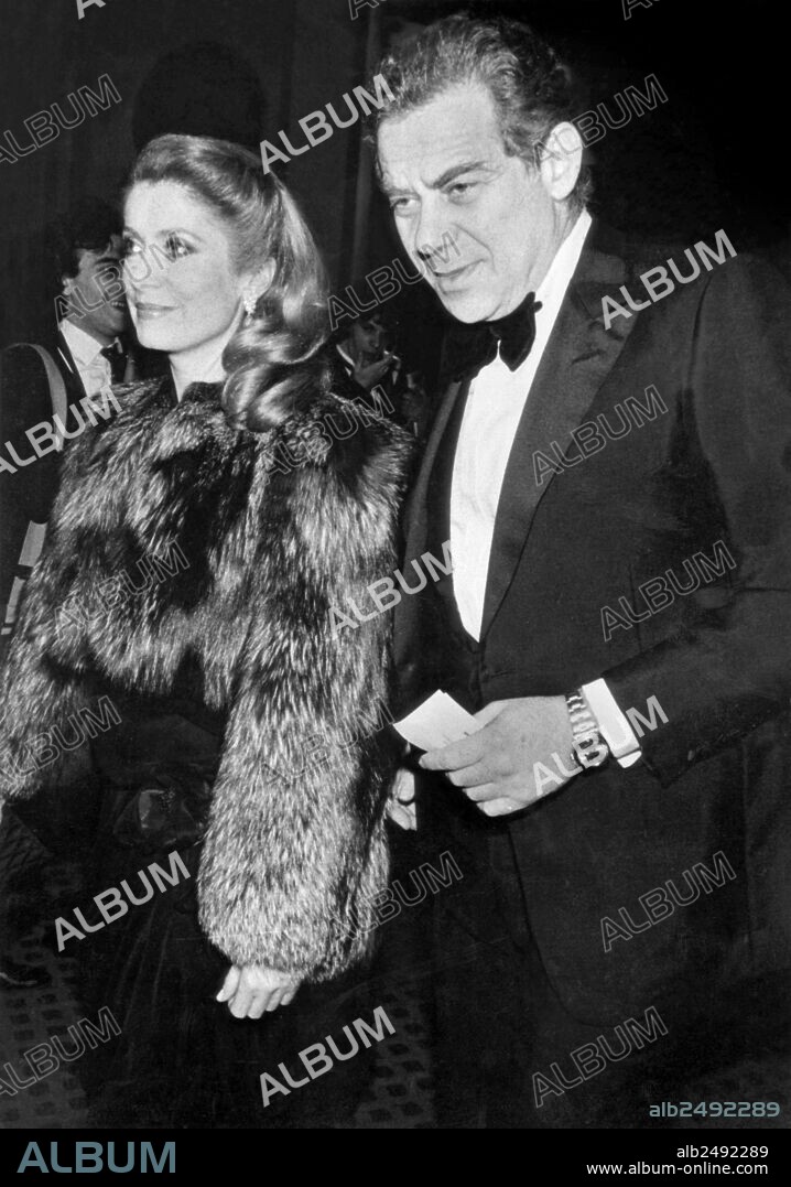Gerard Lebovici , french movie producer, founder of Artmedia agency, and founder of Champ Libre publishing, here with Catherine Deneuve in Paris for Cesar movie prize ceremony february 27, 1982.