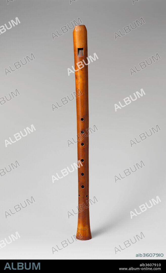 Tenor Recorder. Culture: Italian or British. Dimensions: Height: 12 13/16 in. (32.5 cm). Maker: Bassano (workshop active 1530-1650, Venice and London). Date: ca. 1600.
A rare example of a Renaissance tenor recorder made of a single piece of boxwood.  As is typical of early woodwind instruments, there are seven tone holes, six down the center and a pair of holes at the bottom that sound the same pitch.  This arrangement allows a player to choose their own hand placement for the top and bottom holes.  There is a single thumb hole on the back of the instrument.  
The recorder bears the mark of the Bassano family, a moth, which appears once below the window, and twice on the bottom edge of the instrument. Members of the Bassano family were active as musicians and woodwind makers in both Venice and London from the 1530s to the 1650s.