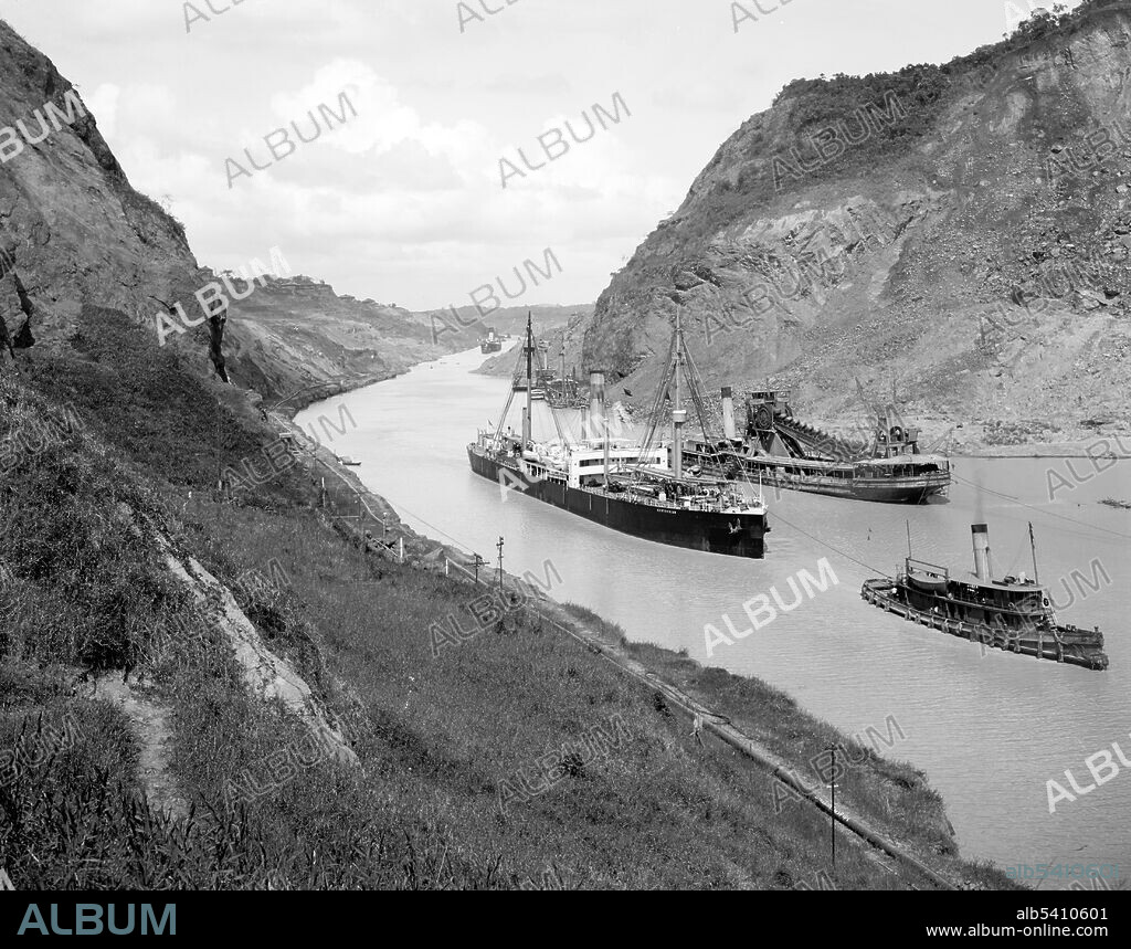 Culebra Cut, looking north between the two highest hills. Photographed between 1910 and 1920. The Panama Canal is an artificial 82 km (51 mi) waterway in Panama that connects the Atlantic Ocean with the Pacific Ocean. The canal cuts across the Isthmus of Panama and is a conduit for maritime trade. Canal locks are at each end to lift ships up to Gatun Lake, an artificial lake created to reduce the amount of excavation work required for the canal, 26 m (85 ft) above sea level, and then lower the ships at the other end. France began work on the canal in 1881, but stopped due to engineering problems and a high worker mortality rate. The United States took over the project in 1904 and opened the canal on August 15, 1914.
