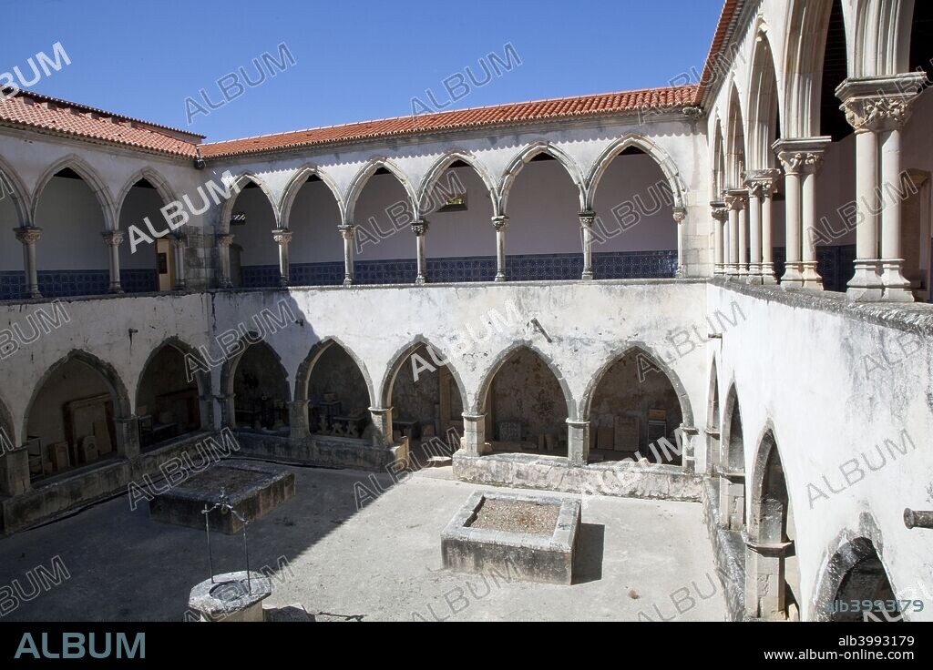 The Cloister of the Cemetery, the Convent of the Knights of Christ, Tomar, Portugal, 2009. The Convent of the Knights of Christ in Tomar is a combination of a castle and a convent and was used by the Knights Templar. Tomar itself was founded in the 12th century as the headquarters of the Knights Templar in Portugal. In order to establish an easy cohabitation between the town and the Convent of the Knights of Christ, the castle was built in three distinct walled enclosures, surrounded by an extensive outer wall. The largest enclosure, which faced southwards, was the walled town, whose gateway overlooked the area known as Sete Montes. In the 16th century the town was emptied of its inhabitants and transformed into kitchen gardens and orchards for the monks of the Order of Christ. In recent times the vegetable gardens have been replaced by the Parque do Laranjal, where can be found evidence of the old town in the stones of the doorways and windows that have been preserved by time. The Templar Castle and the Convent were declared a World Heritage Site by UNESCO in 1983.