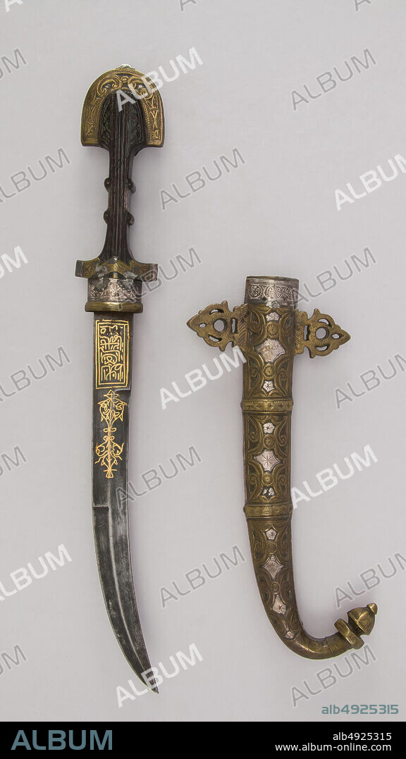 Dagger (Jambiya) with Sheath, Moroccan, 19th century, Moroccan, Steel, wood, silver, brass, gold, niello, H. with sheath 16 13/16 in. (42.7 cm); H. without sheath 16 5/8 in. (42.2 cm); H. of blade 10 1/4 in. (26 cm); W. 2 1/4 in. (5.7 cm); Wt. 9.6 oz. (272.2 g); Wt. of sheath 13.3 oz. (377 g), Daggers.