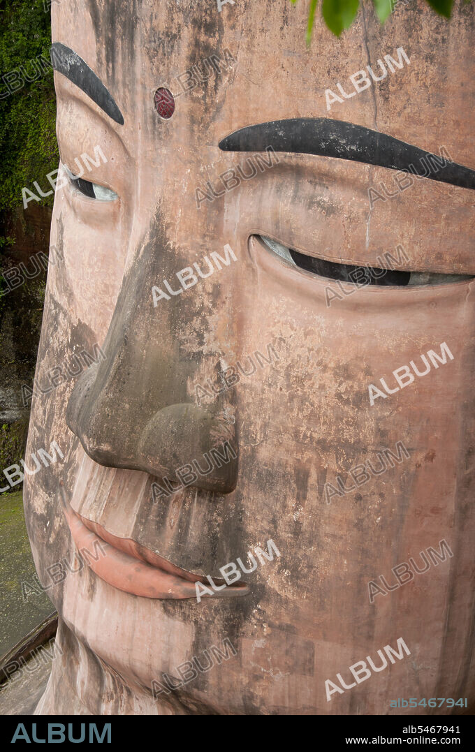 The Leshan Giant Buddha (Lèshan Dàfó) was built during the Tang Dynasty (618–907 CE). It is carved out of a cliff face that lies at the confluence of the Minjiang, Dadu and Qingyi rivers in the southern part of Sichuan province in China, near the city of Leshan. The stone sculpture faces Mount Emei, with the rivers flowing below his feet. It is the largest carved stone Buddha in the world and at the time of its construction was the tallest statue in the world.