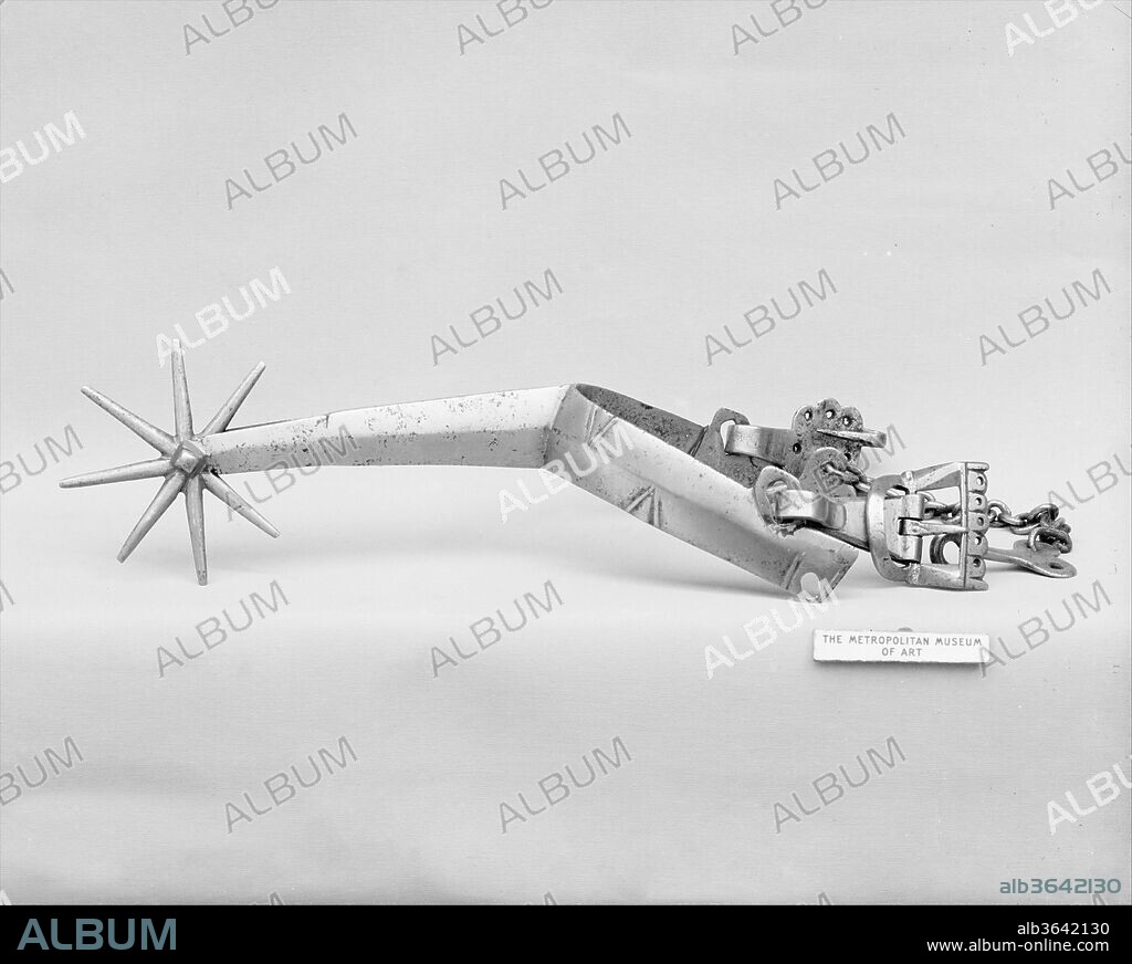 Rowel Spur (Right). Culture: Hungarian or German. Dimensions: L. 9 in. (22.9 cm); W. 4 1/4 in. (10.8 cm); Diam. of rowel 3 in. (7.6 cm); Wt. 10.7 oz. (303.3 g). Date: ca. 1500.
In the 15th century, rowel spurs with very long necks were of common use in western Europe. At this period, the elevated war saddles and the very specific riding style, with long stirrup leathers and legs extended forward, had the consequence of taking away the rider's feet from the horse's flank. Thus, these long necks gave them easier access without having to disturb the rider's position.