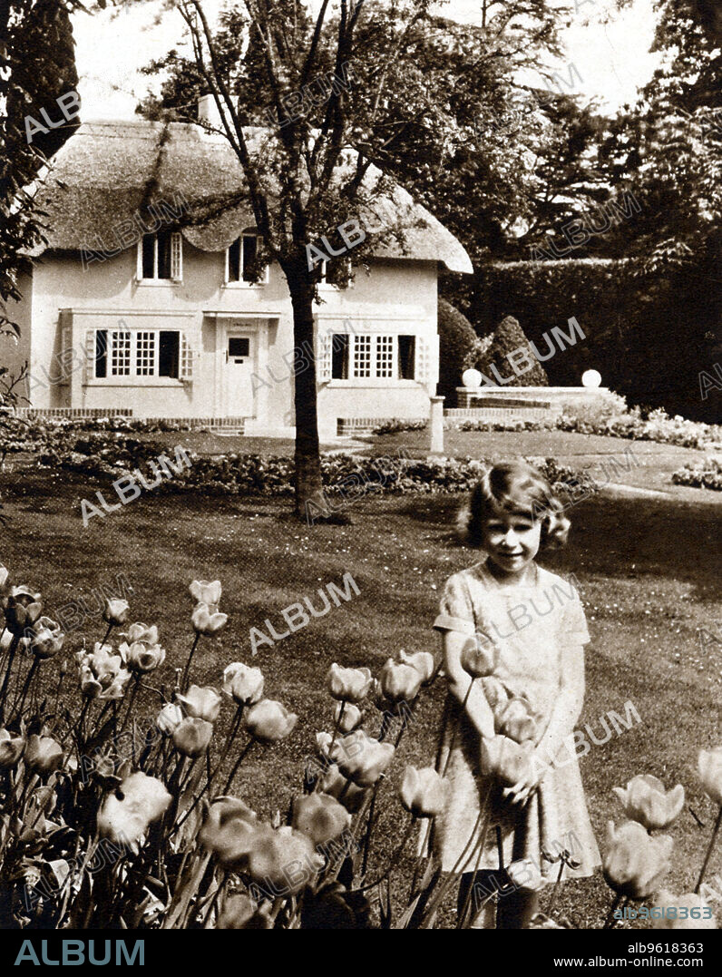Princess Elizabeth, future Queen of Great Britain, Windsor, 1930s. Elizabeth (b1926) as a child in the garden of the Royal Lodge, Windsor with Y Bwthyn Bach (The Little House) the playhouse given to her by the people of Wales.