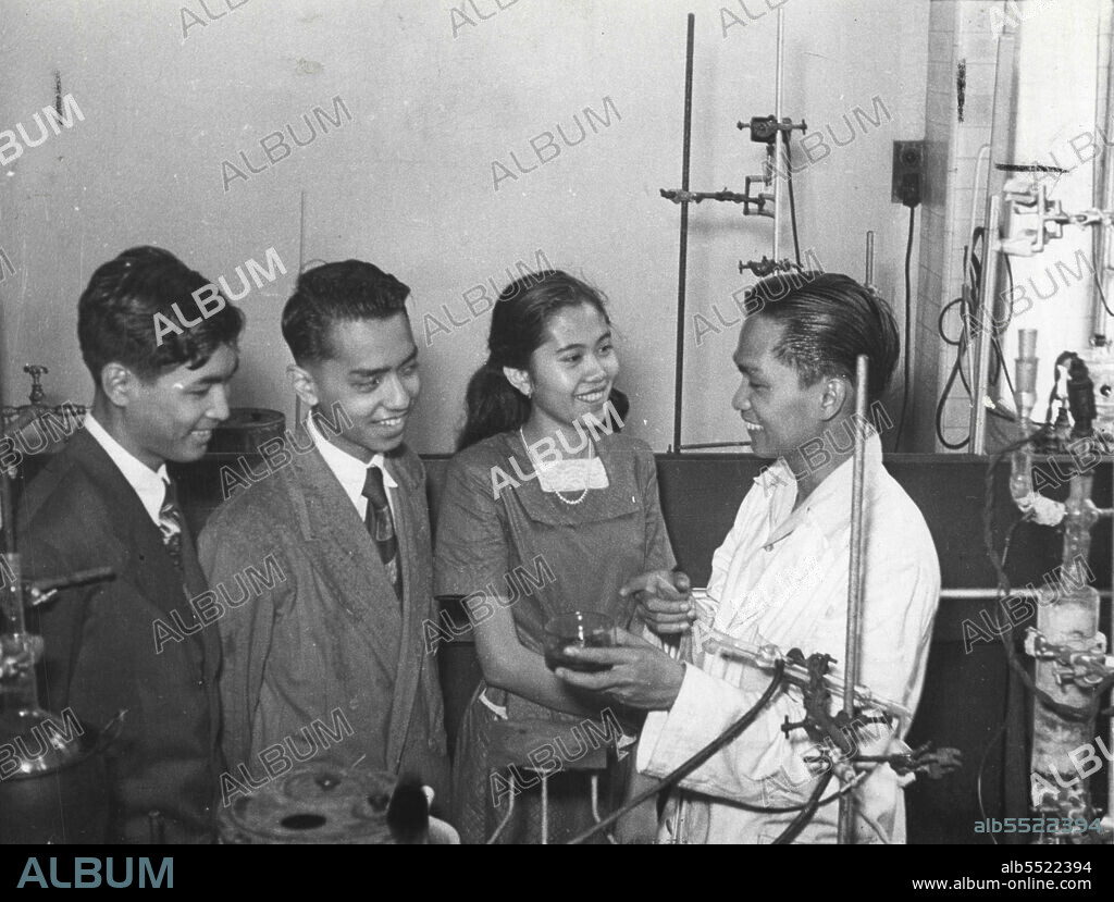 "What's That solution" the others asked Felix Maramba at the chemistry laboratory. Mr. Maramba, who is the son of the director of plant industry in the Philippines, is taking post-graduate course in Chemistry as a Unesco fellow under the the Australian Government Education Scheme for Asiatic students. May 23, 1955.