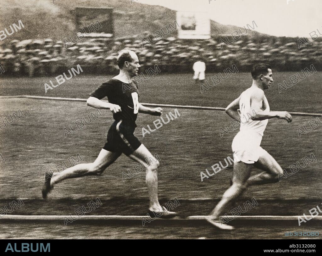 Berlin, Germany:  1931 Paavo Nurmi, the flying Finn, as he was about to pass German runner Max Danz in the 10,000 meter run at the Berlin Sports Club.