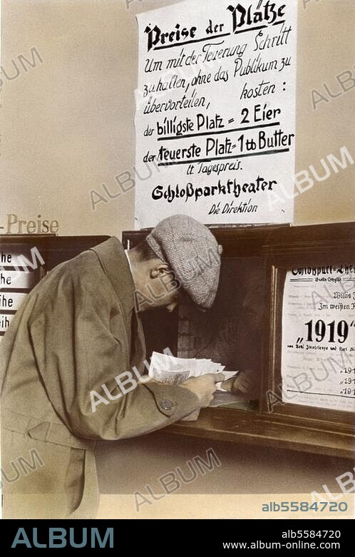 Weimar Republic / Inflation 1923:. Paying in kind at the ticket office of the Schlosspark Theatre in Berlin; the sign states that the cheapest seat cost 2 eggs, the most expensive seat a tablespoon of butter. Photo, 19 September 1923. Coloured at a later stage.