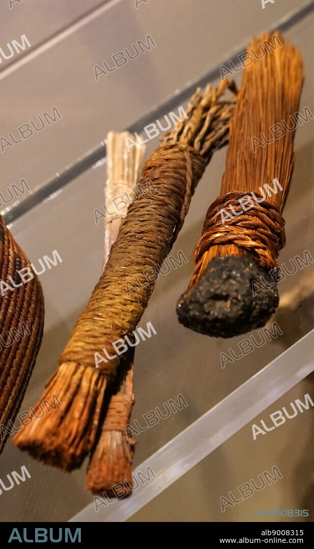 Paint brushes made of palm fibre, stained with ancient paint and bitumen.