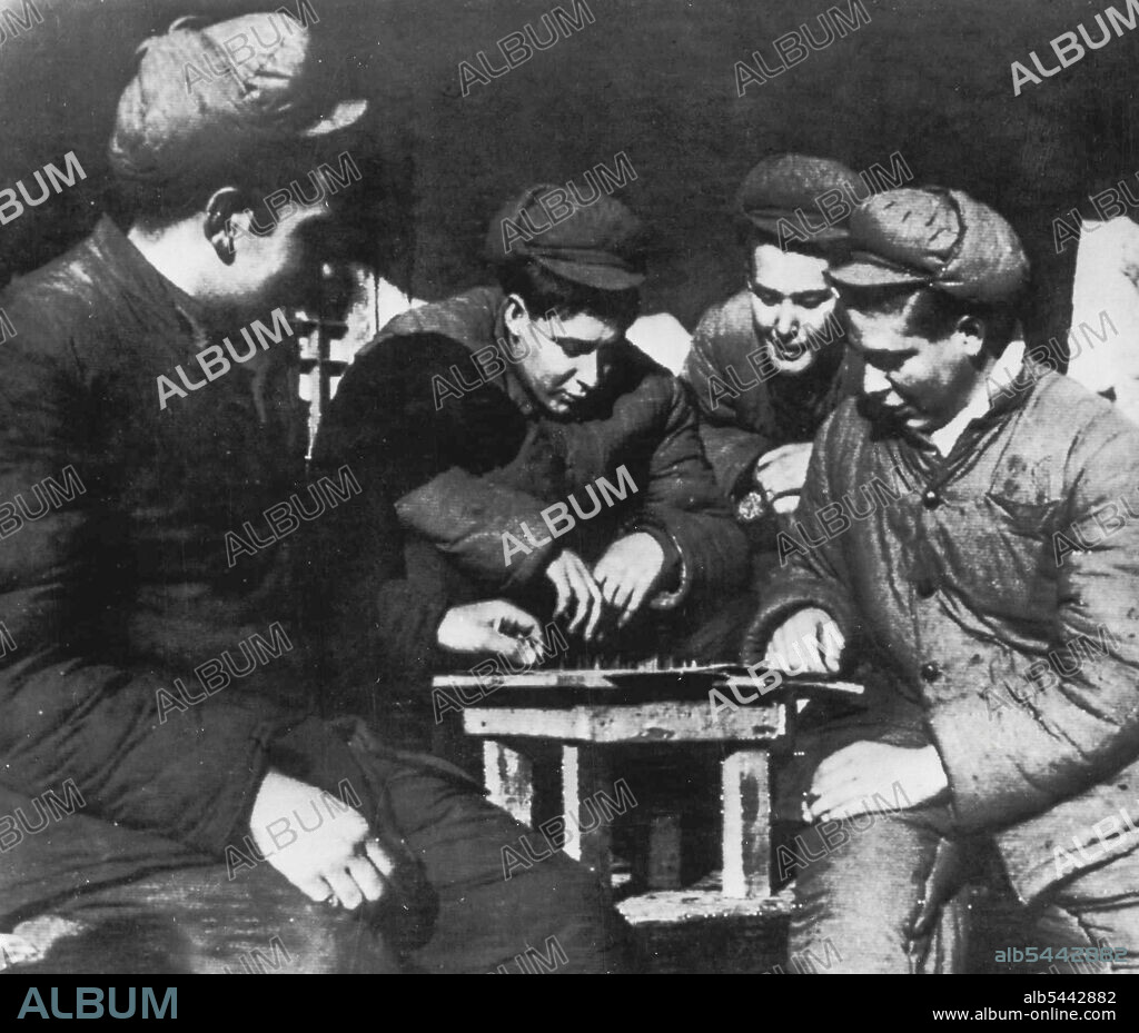Additional Prisoner of War Pictures -- This is another picture of Americans held prisoners of war by the Communists in North Korea taken by Frank Noel, Associated Press staff photographer himself a prisoner. The picture, one of a series, was made with consent of Noel's captors at prisoner of war camp No. 5 at Pyokdong on the Korean side of the Yalu river. Noel's captions said it shows (l-r) Robert Brooks, Bismarck, Mo.; Alfred Mcneil, Roxbury, Mass.; James W. Fulk, Rushville, Ind., and Richard J. Krammes, Pock, Pa. Noels pictures are taken to Panmunjom by a Communist courier and turned over to the Associated Press. January 30, 1952. (Photo by AP Wirephoto).