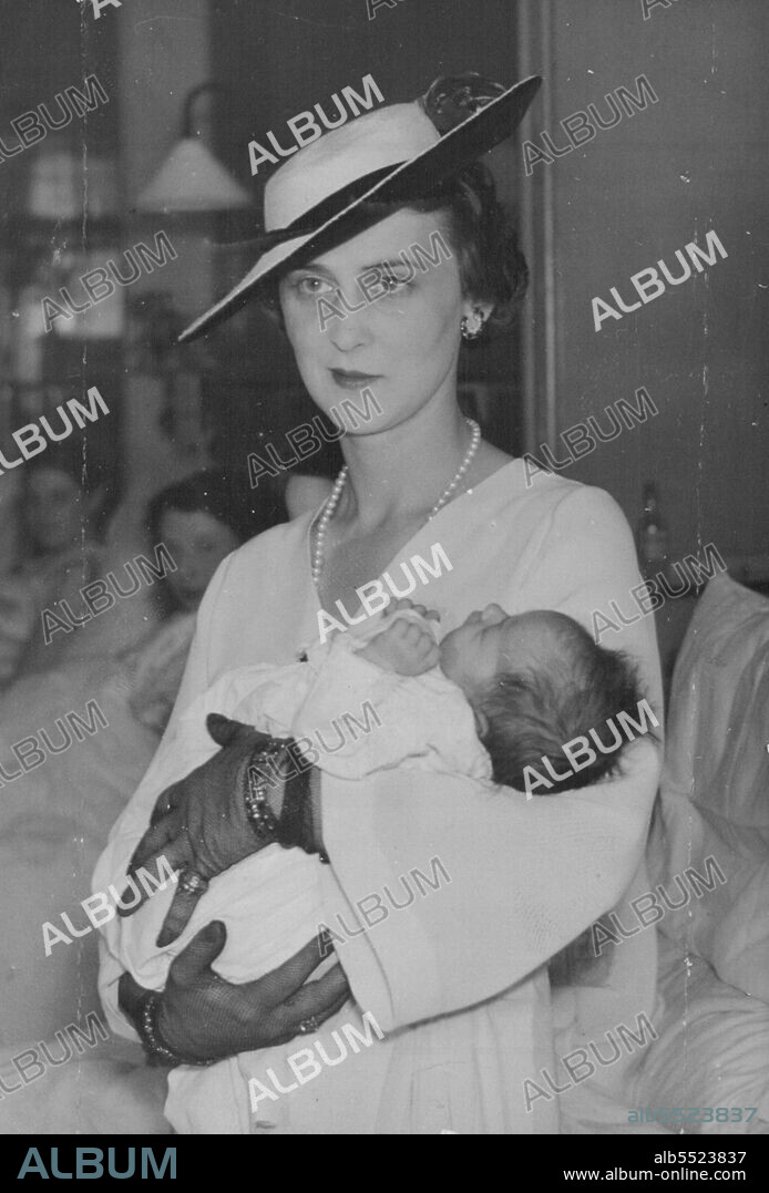 Duchess of Kent's Visited A London Hospital -- The Duchess holding little Patricia Cockril, aged 9 days, during her visit.The Duchess of Kent made a tour of St. George's hospital here this afternoon. May 25, 1937. (Photo by Associated Press Photo).